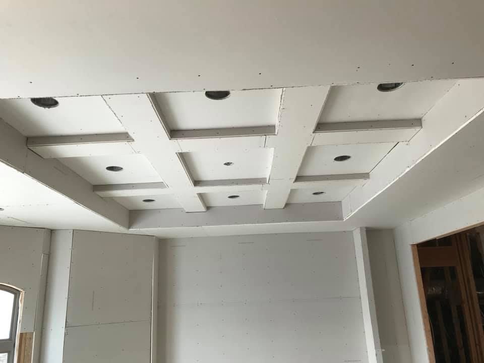 A room with a ceiling that is being remodeled.