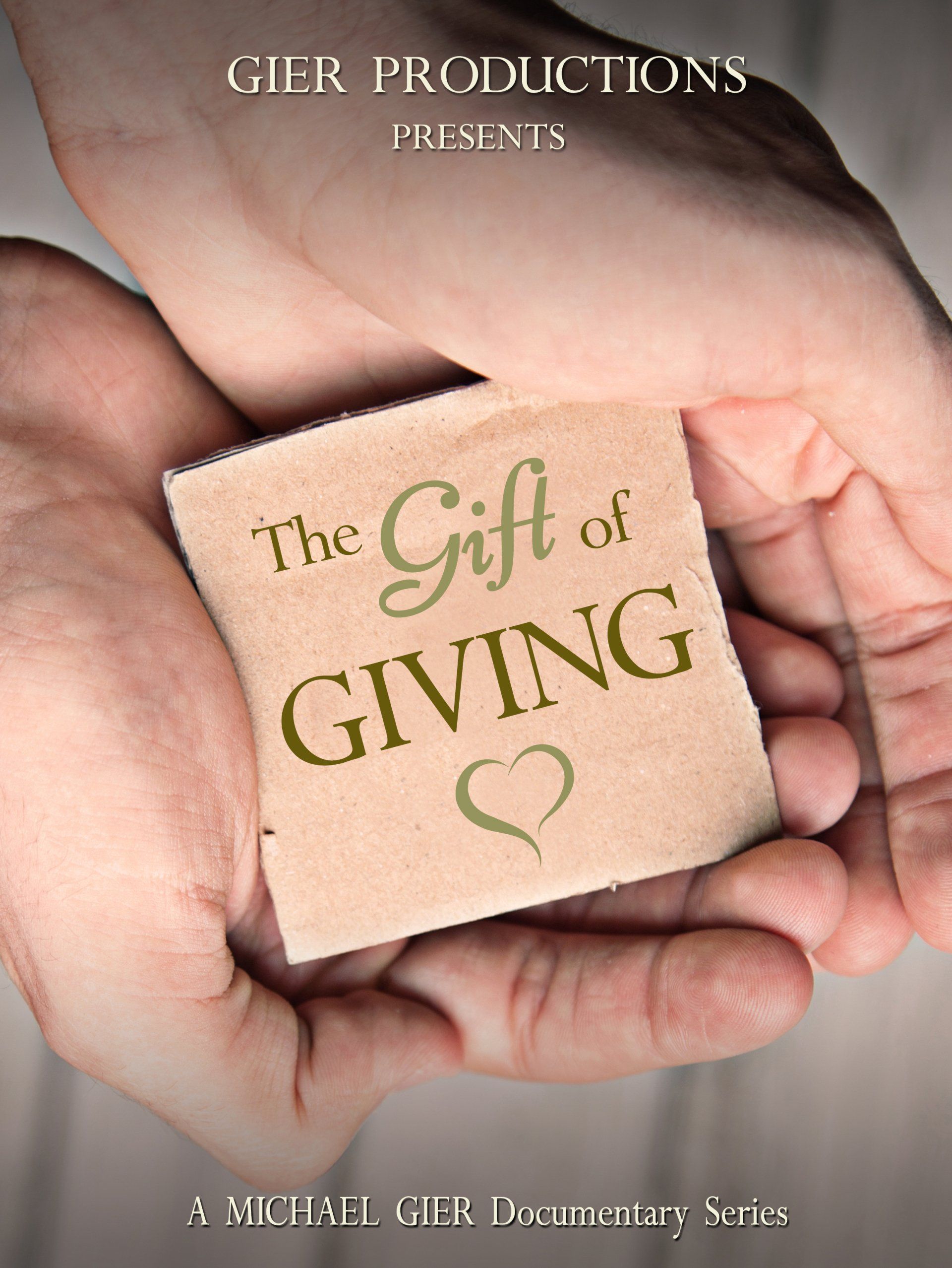 The gift of giving text written on cardboard in someone hands