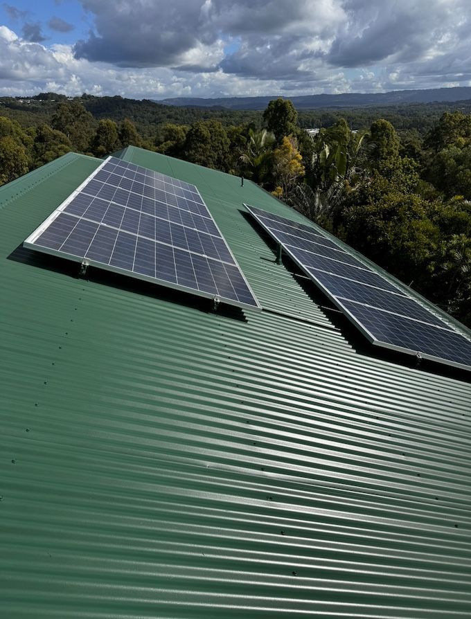 Cleaned And Painted Iron Roof With Solar Panels After — House & Roof Painting & Restorations In Maroochydore, QLD