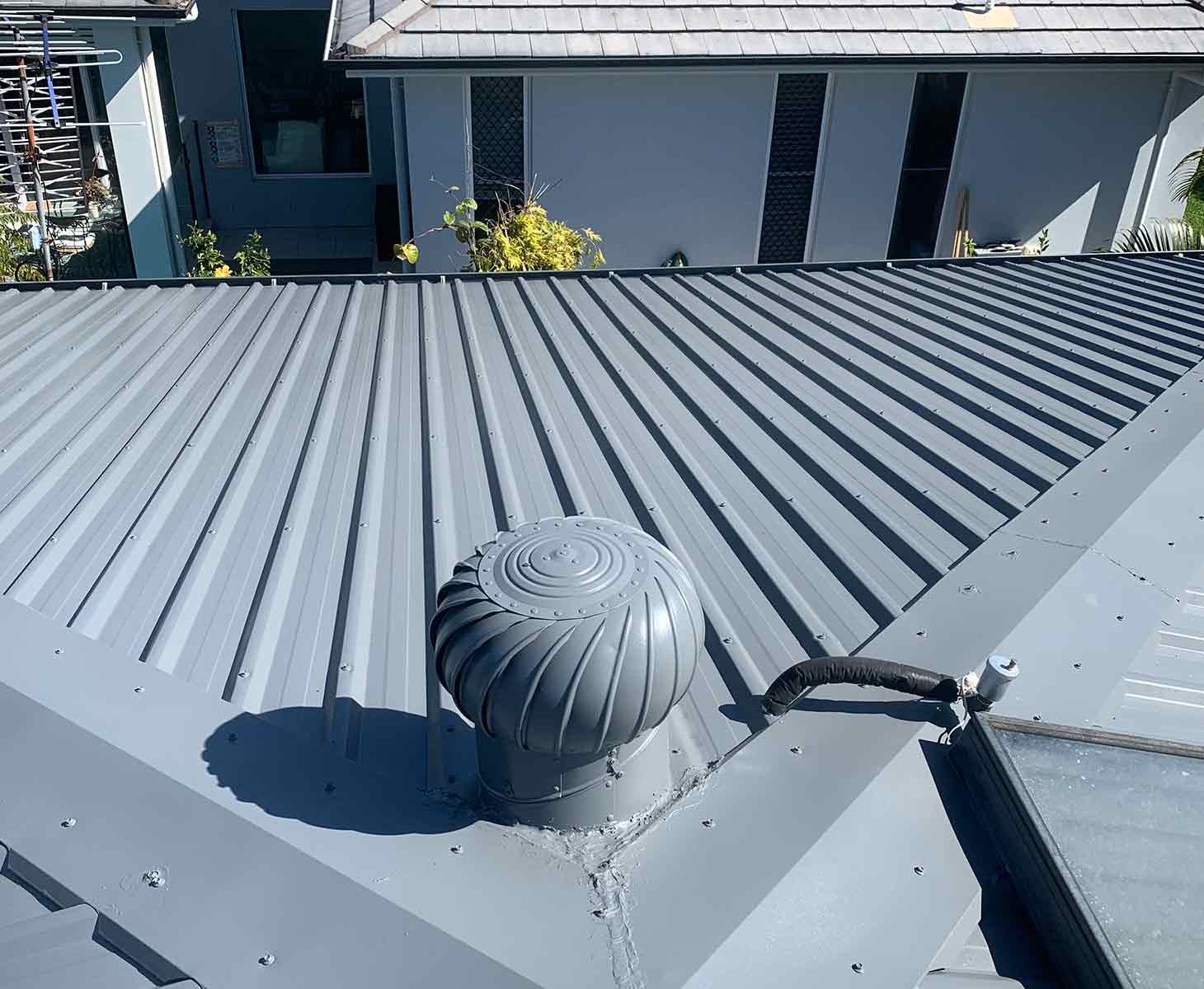 A Roof With A Fan On Top Of It — House & Roof Painting & Restorations In Maroochydore, QLD