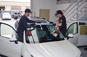 Mechanics Replacing Windshield — Auto Glass Repair in San Marcos, CA