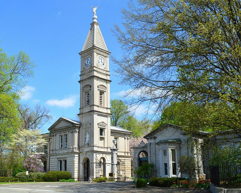 a large building with a clock on top of it KCA, KY