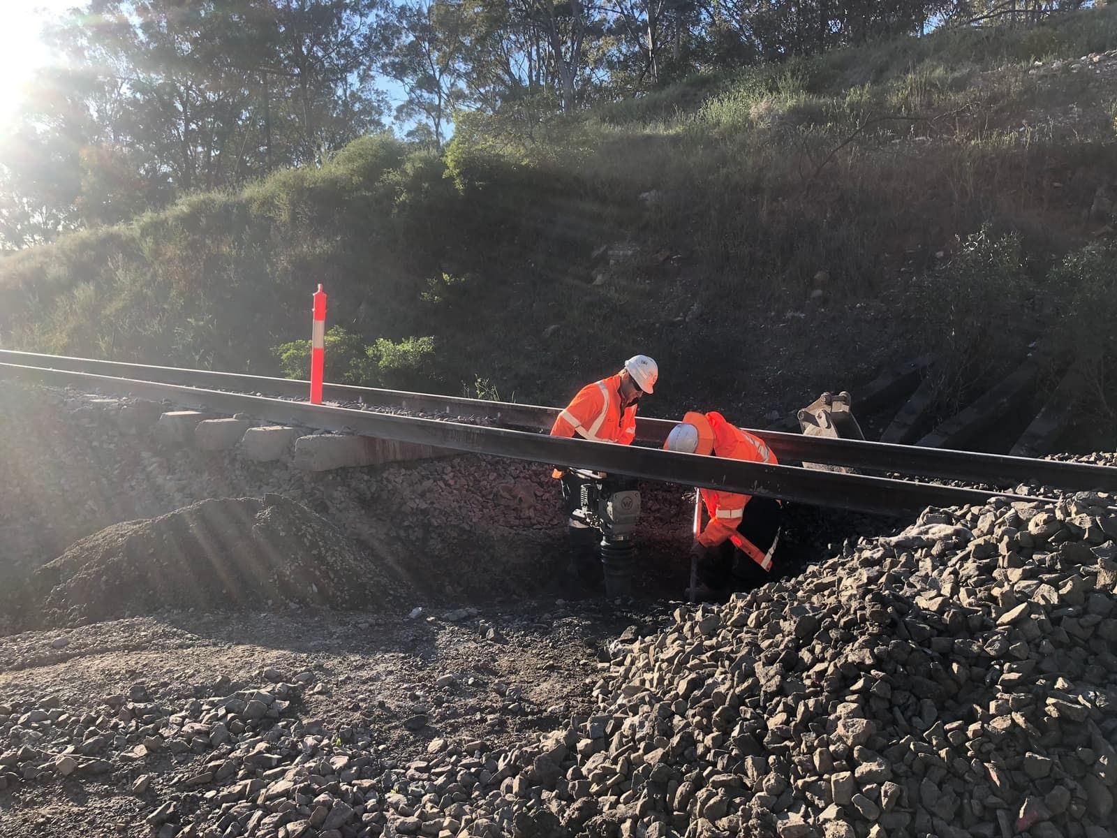 Rail asset maintenance installing subsurface drainage in the rail corridor to remove water from the 4 foot.