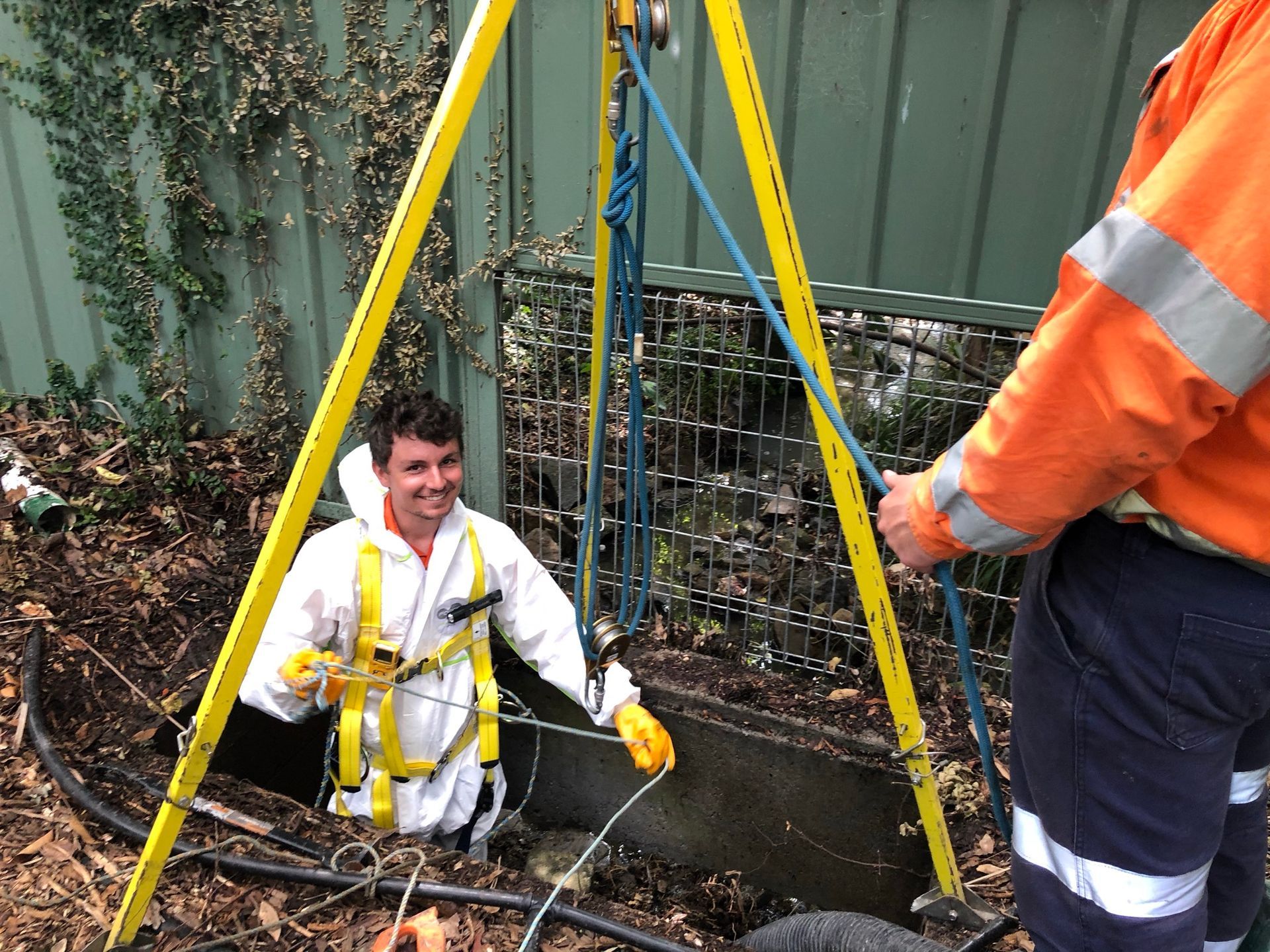 An Aqua Assets team member conducting a CCTV pipeline inspection in a confined space.