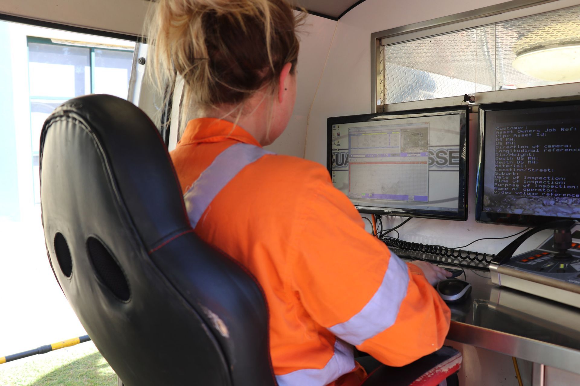 An Aqua Assets team member supervising a CCTV pipeline inspection.