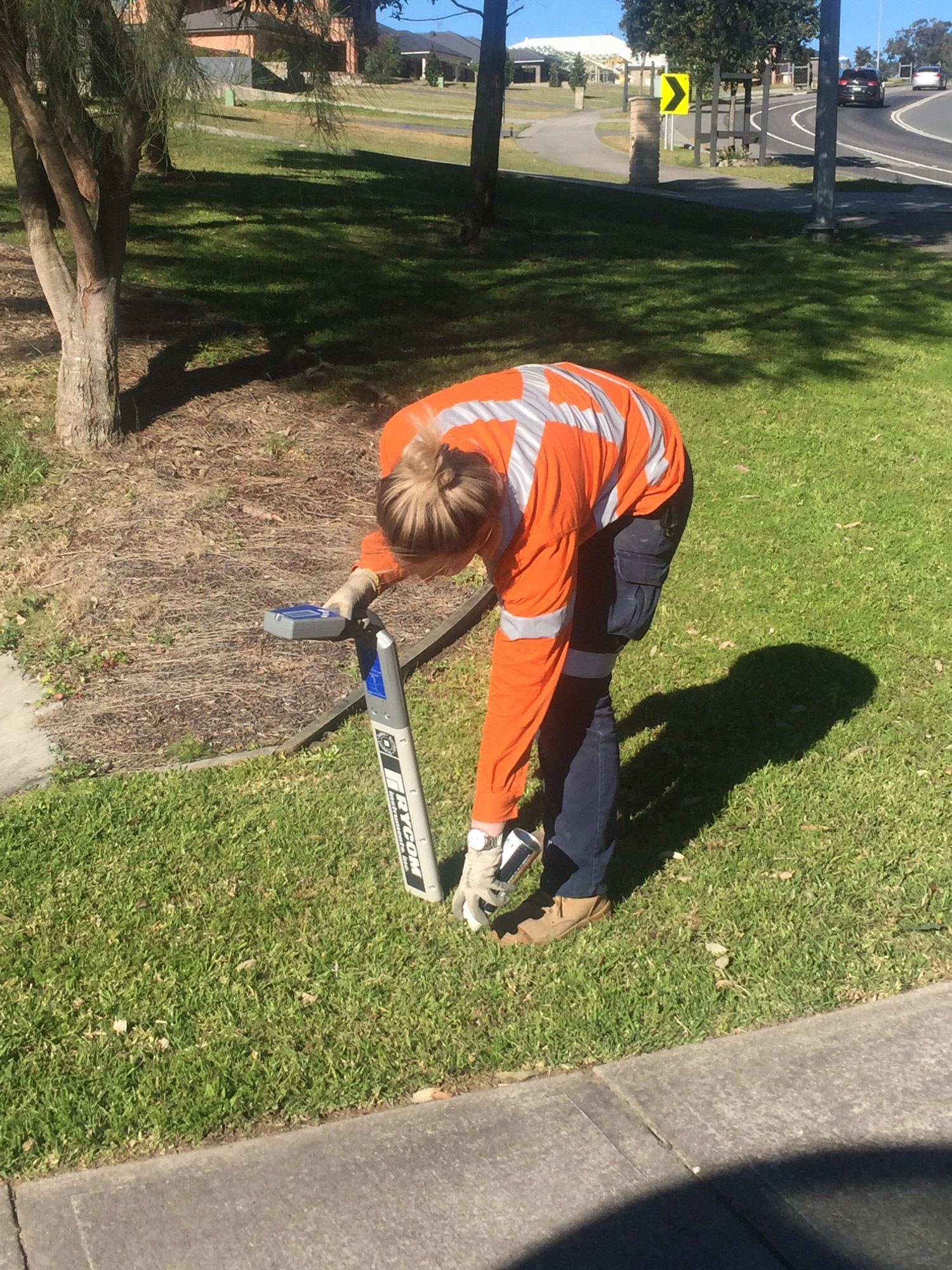 A team member marking the ground to prepare for non-destructive digging of council property.