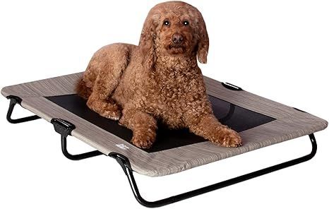 A black mesh dog bed is sitting on a white surface