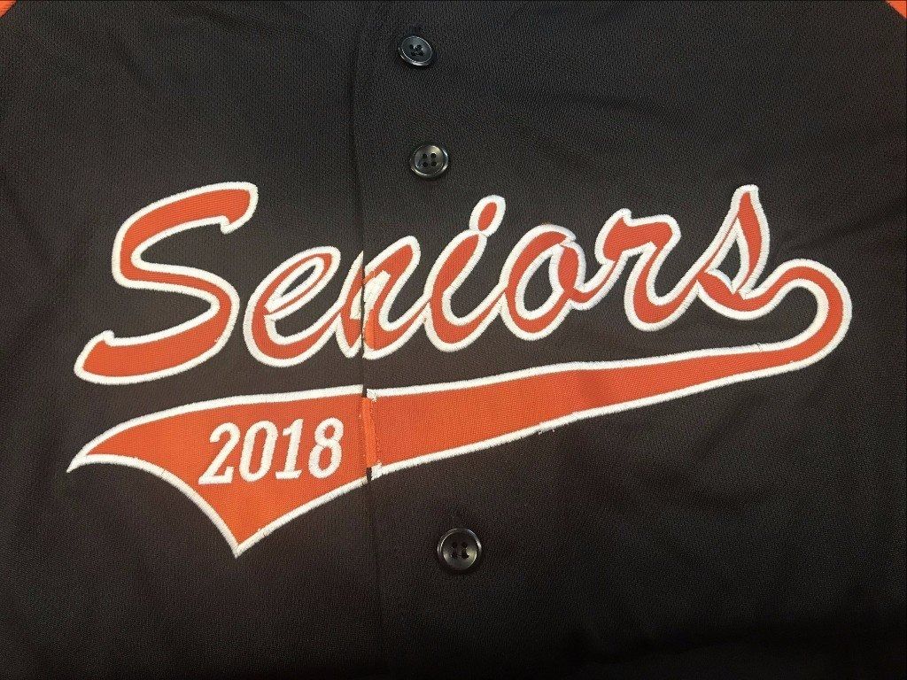 A black baseball-style shirt with 