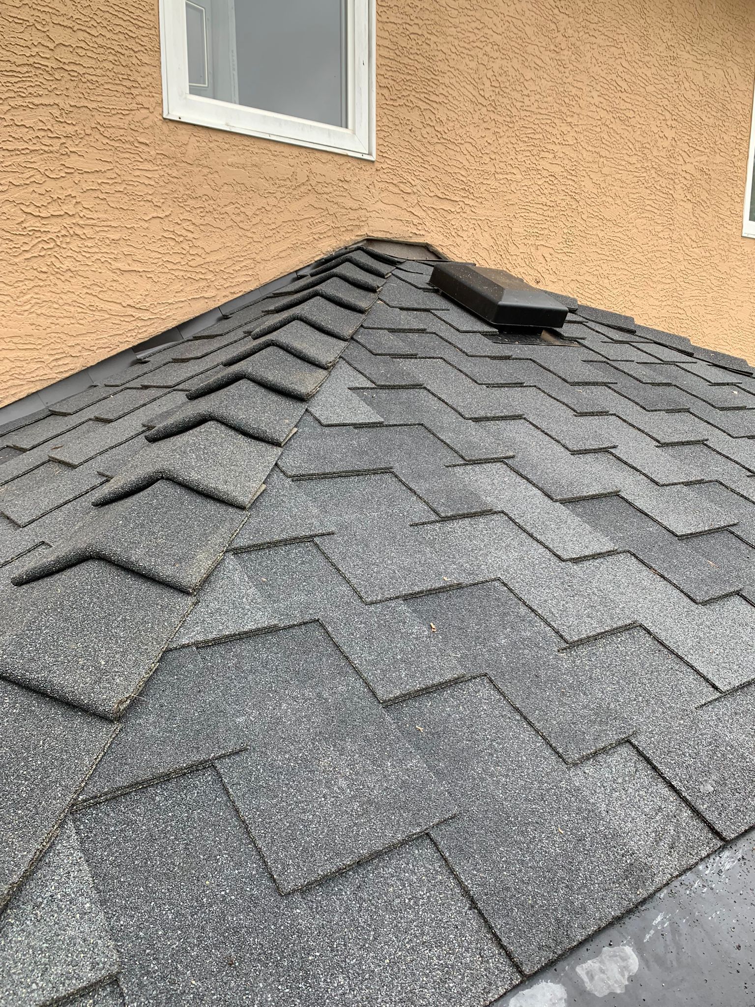 A close up of a roof with shingles on it.