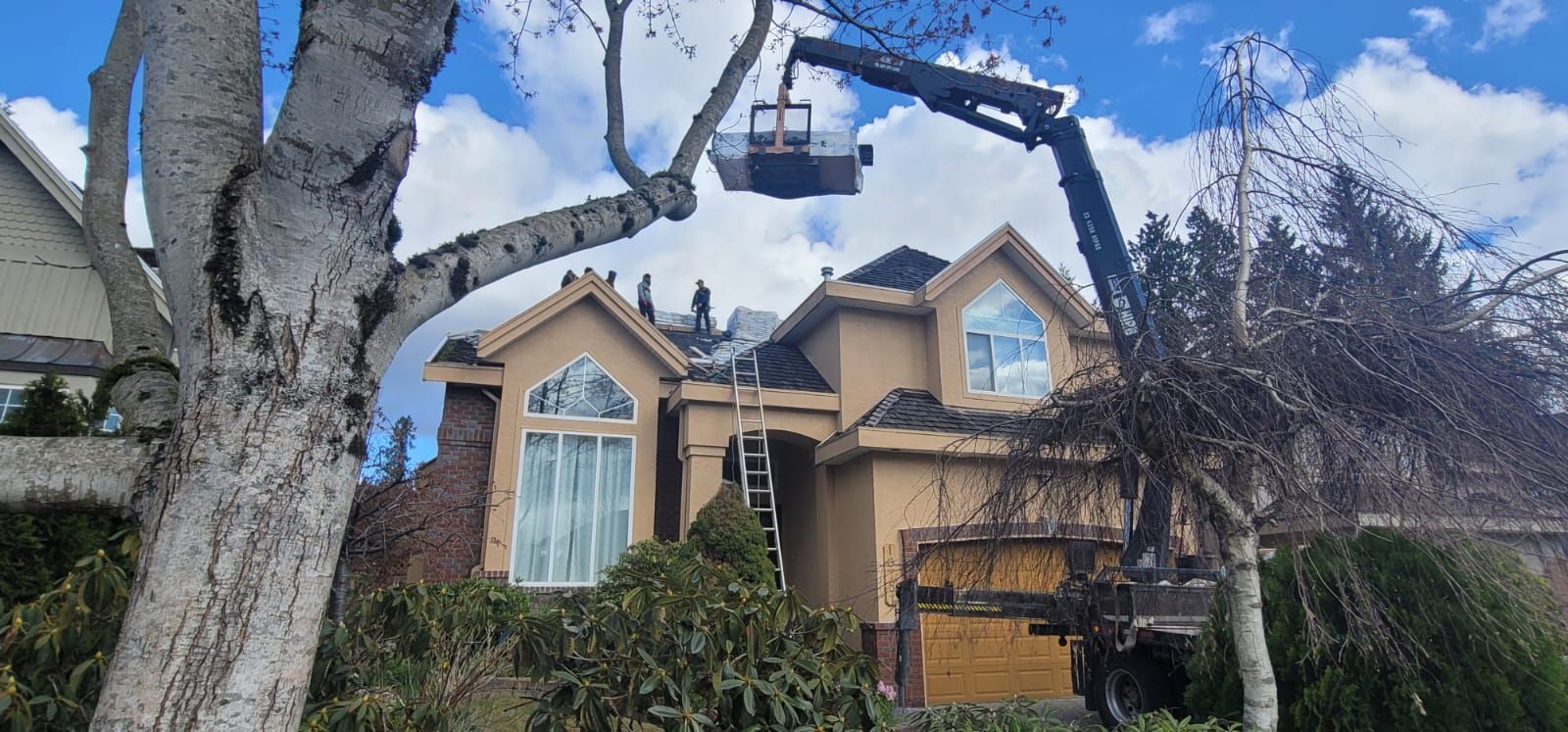 A large house with a crane attached to the side of it.