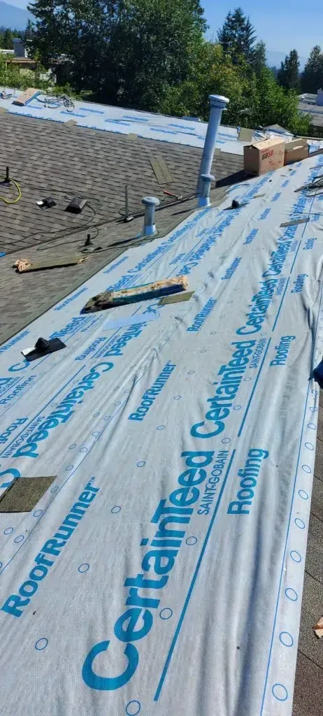 A roof with a lot of roofing material on it.