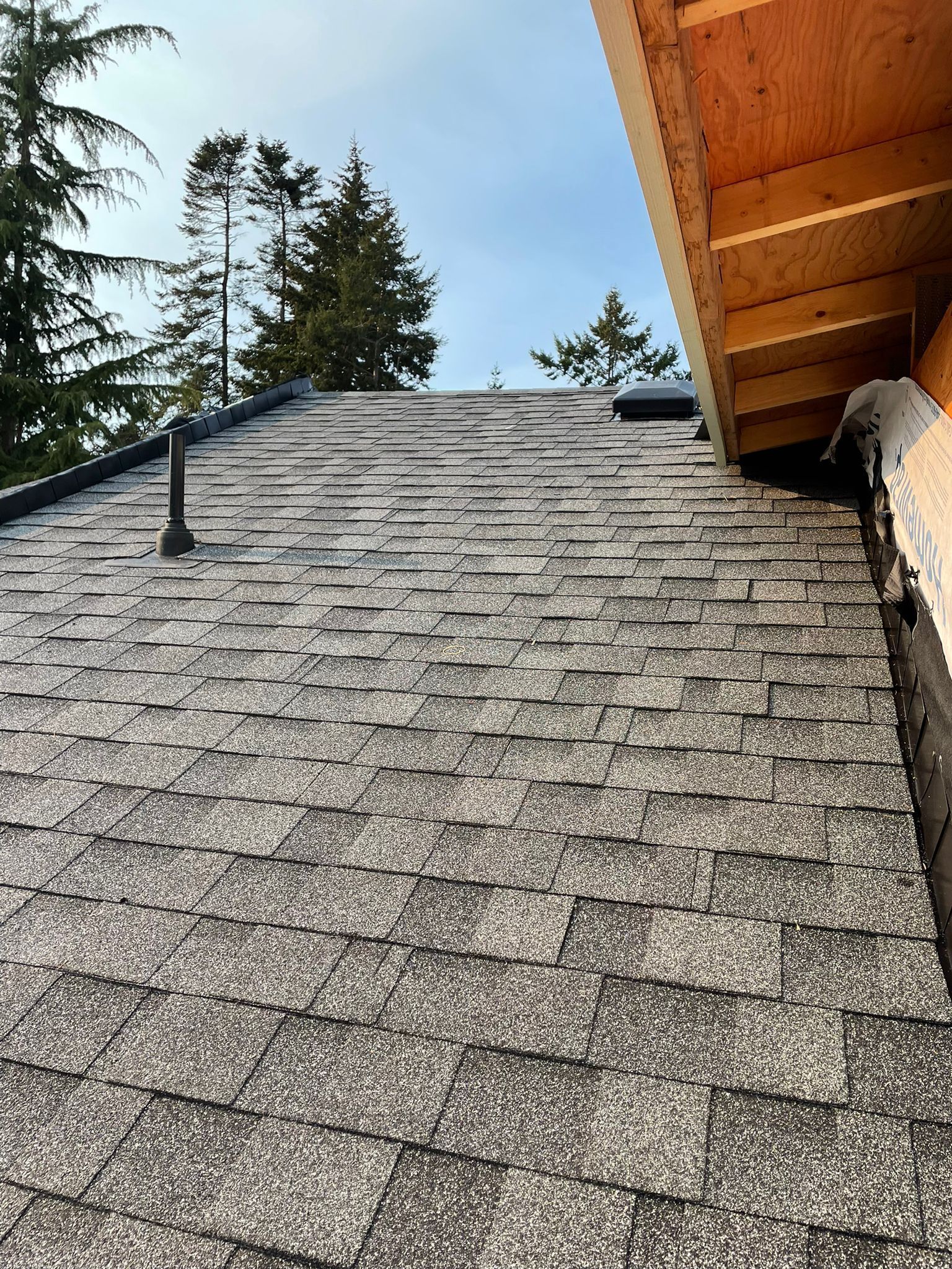 A close up of a roof with shingles on it.