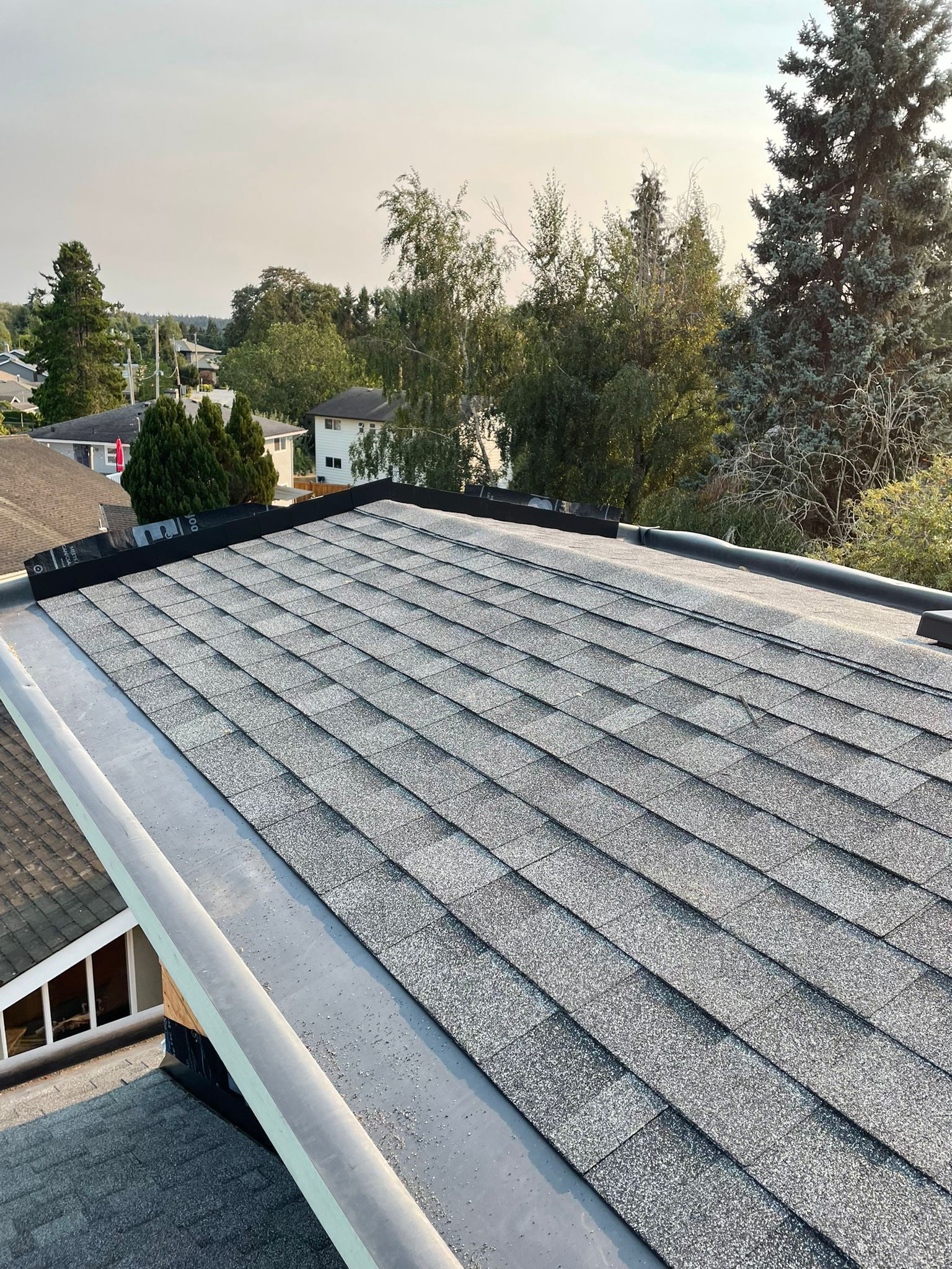 A close up of a roof with a lot of shingles on it.