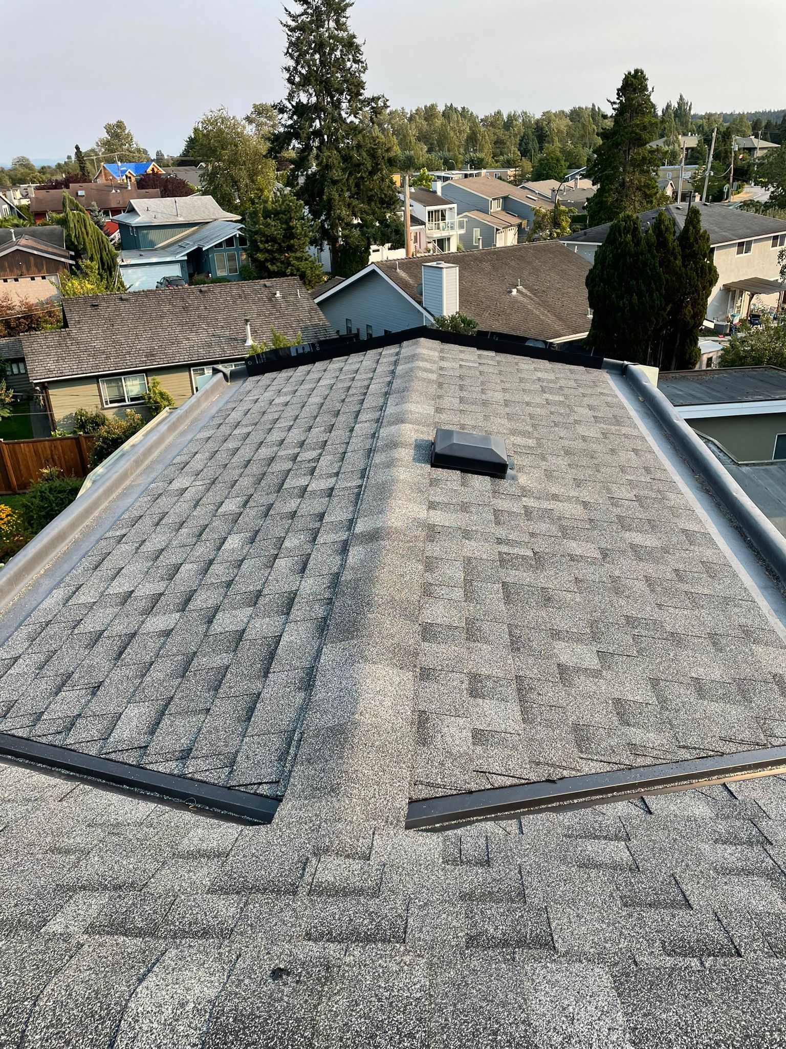 A close up of a roof with a lot of shingles on it.