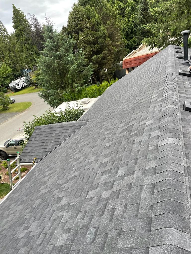 A close up of a roof with a lot of shingles on it.
