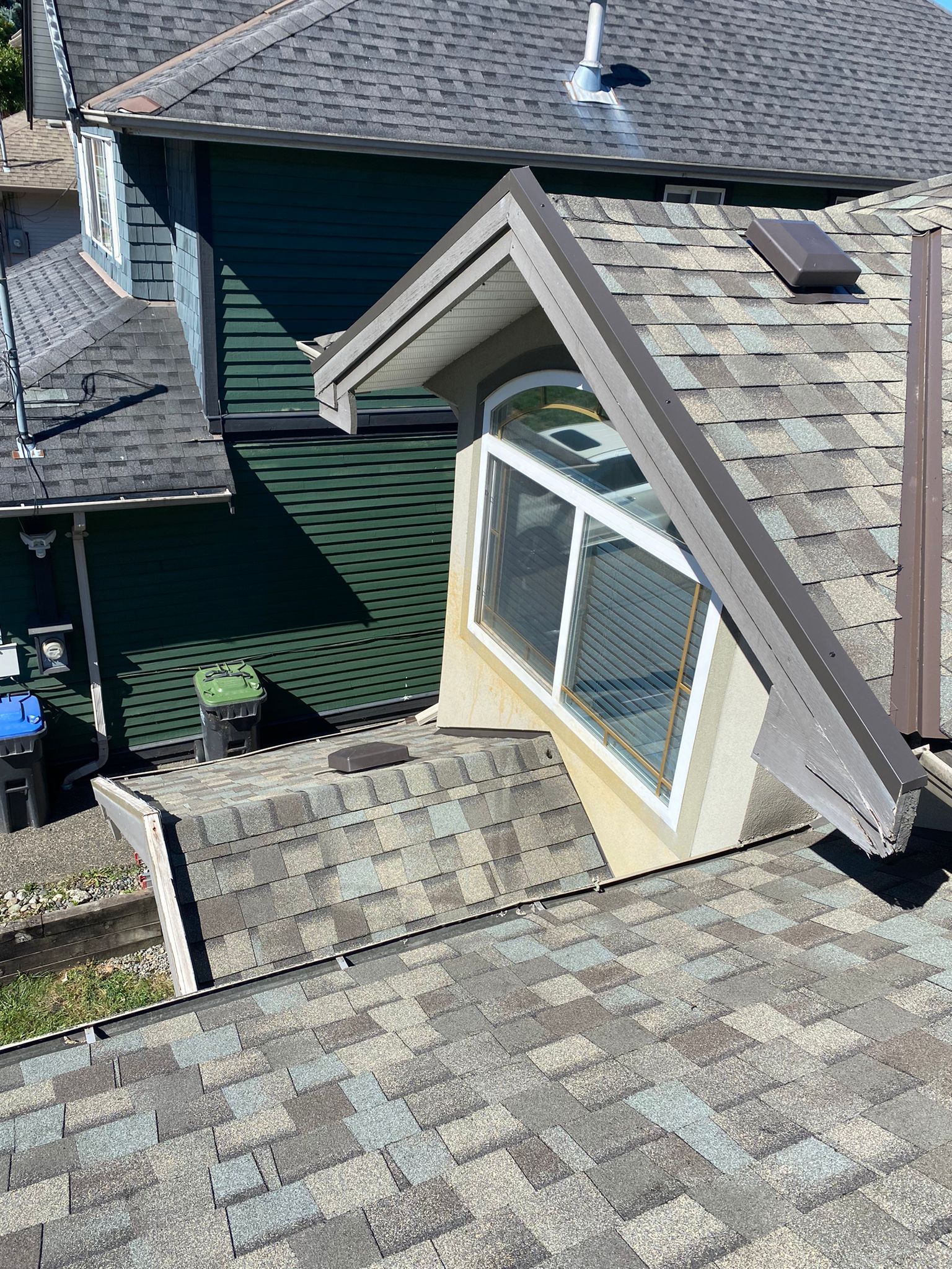 Solar panels against a bright blue sky with fluffy white clouds.