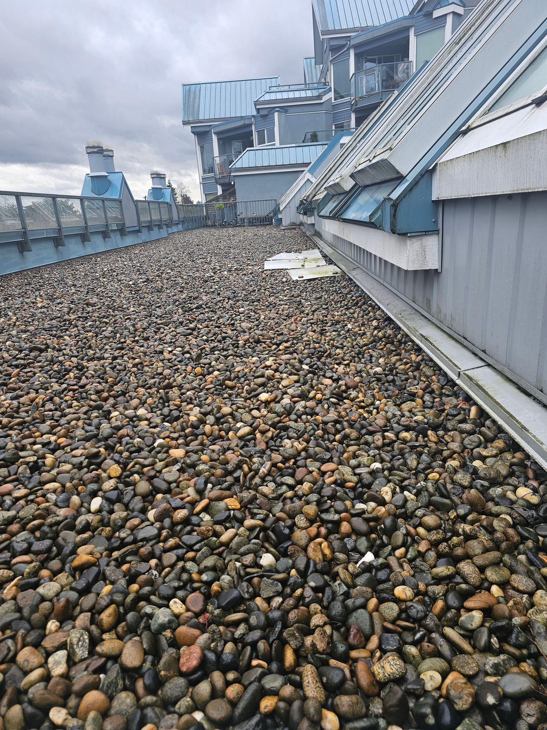 A pile of rocks on the roof of a building.