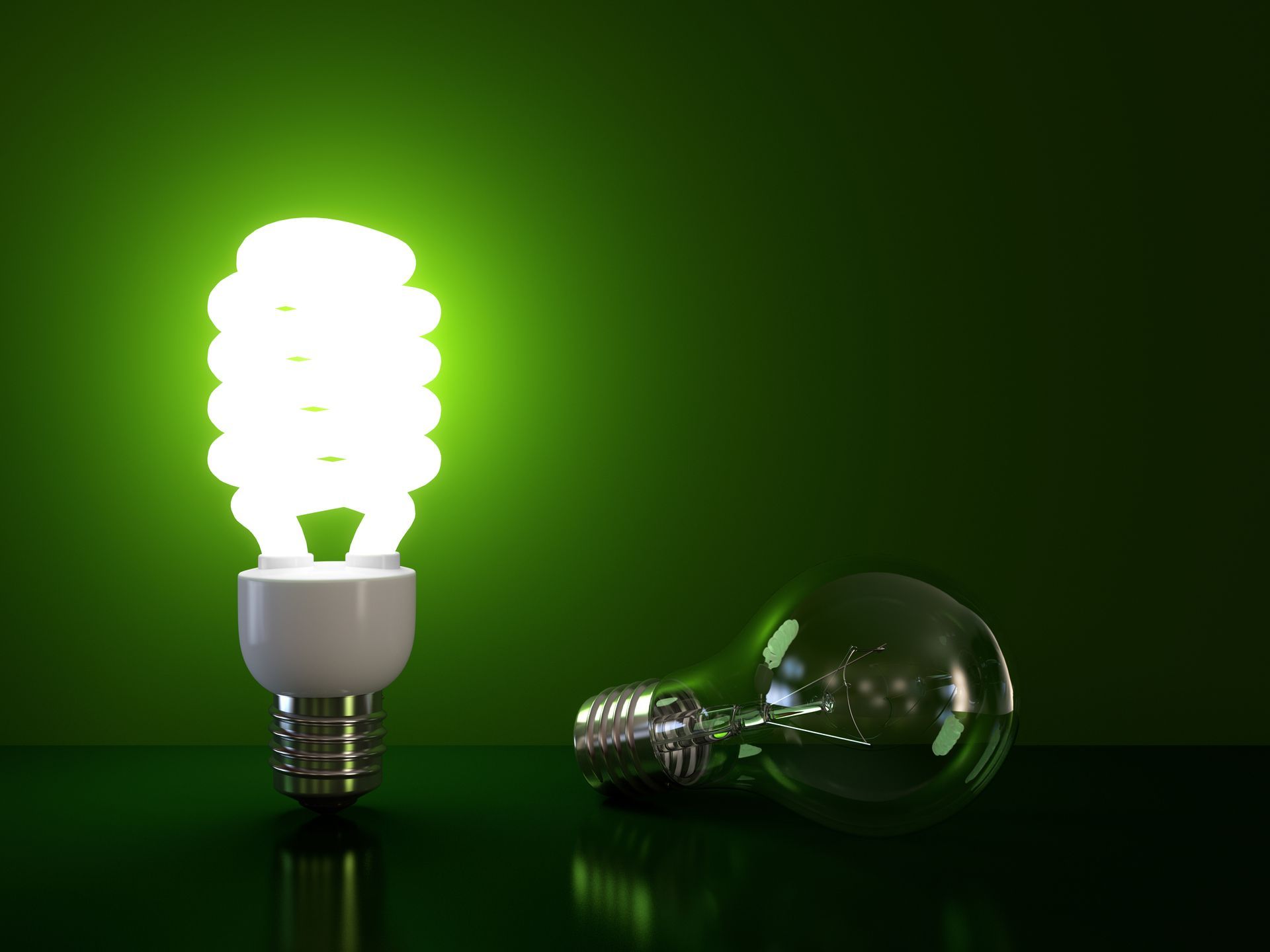 A light bulb is lit up next to a light bulb that is turned off.