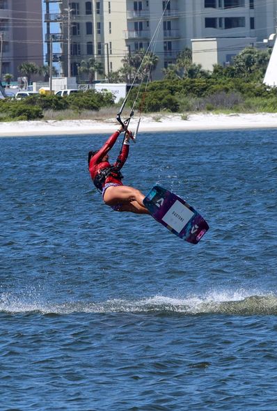 Jennifer backroll jumping Kitebarding