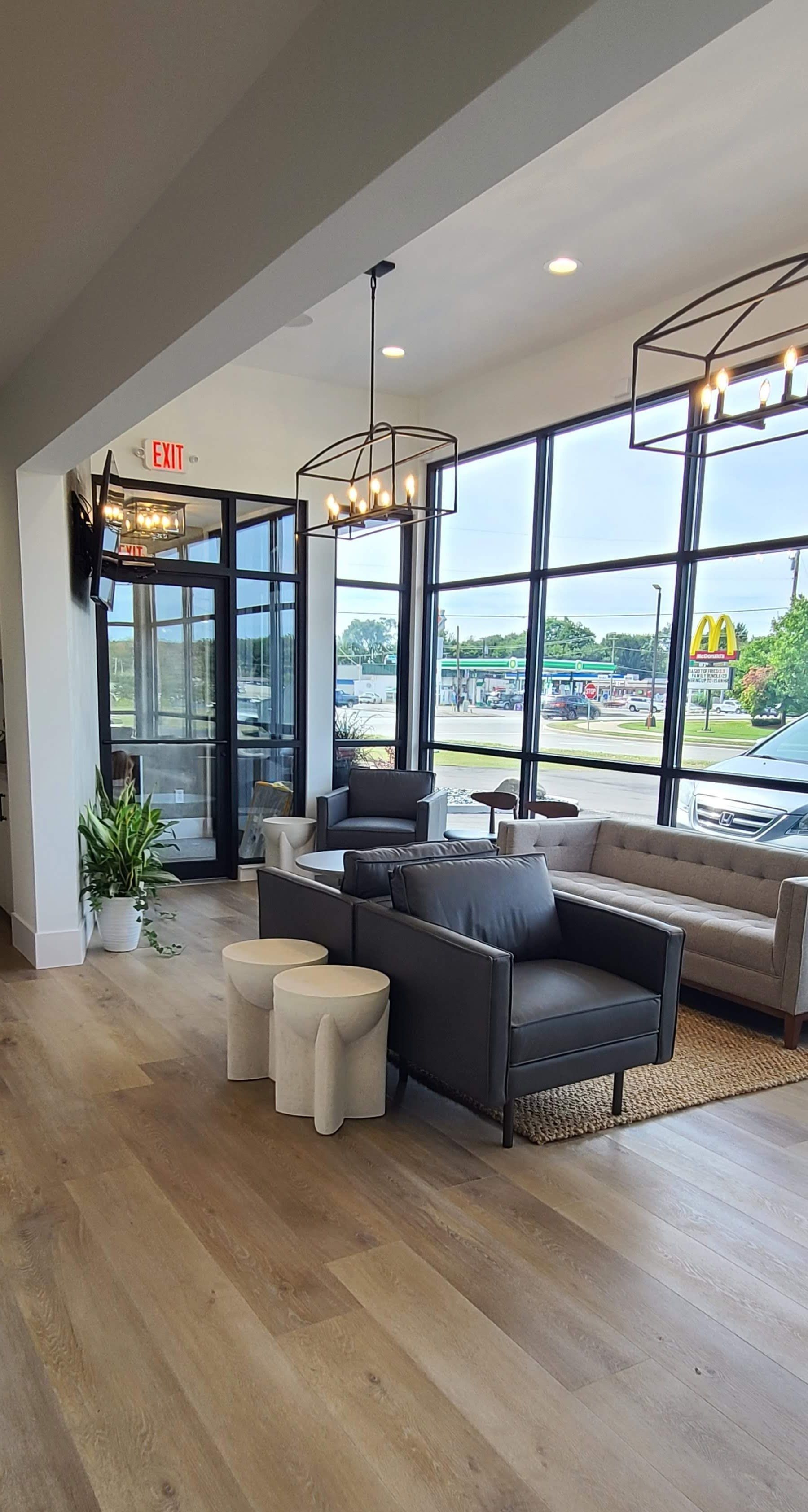 A living room filled with furniture and a lot of windows.