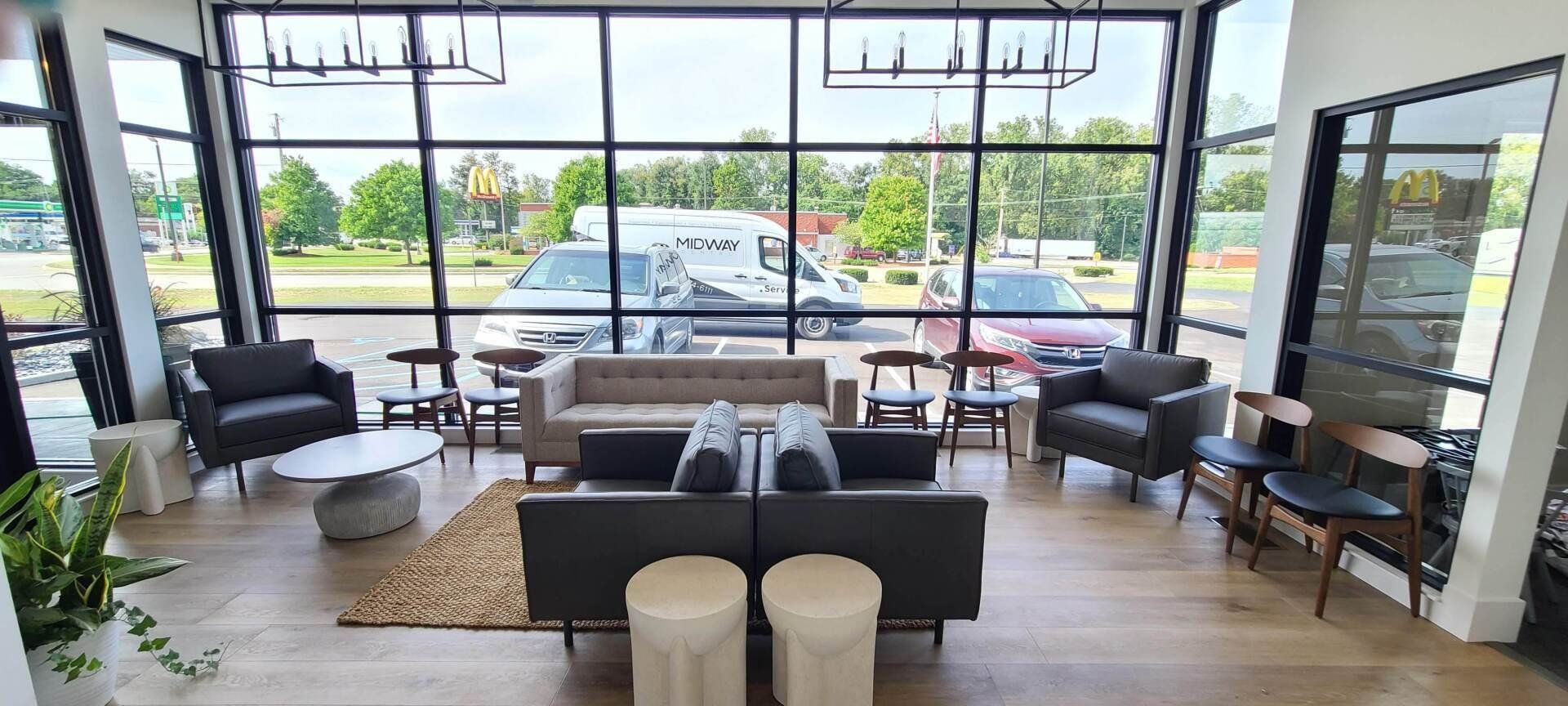 A living room filled with furniture and a large window.