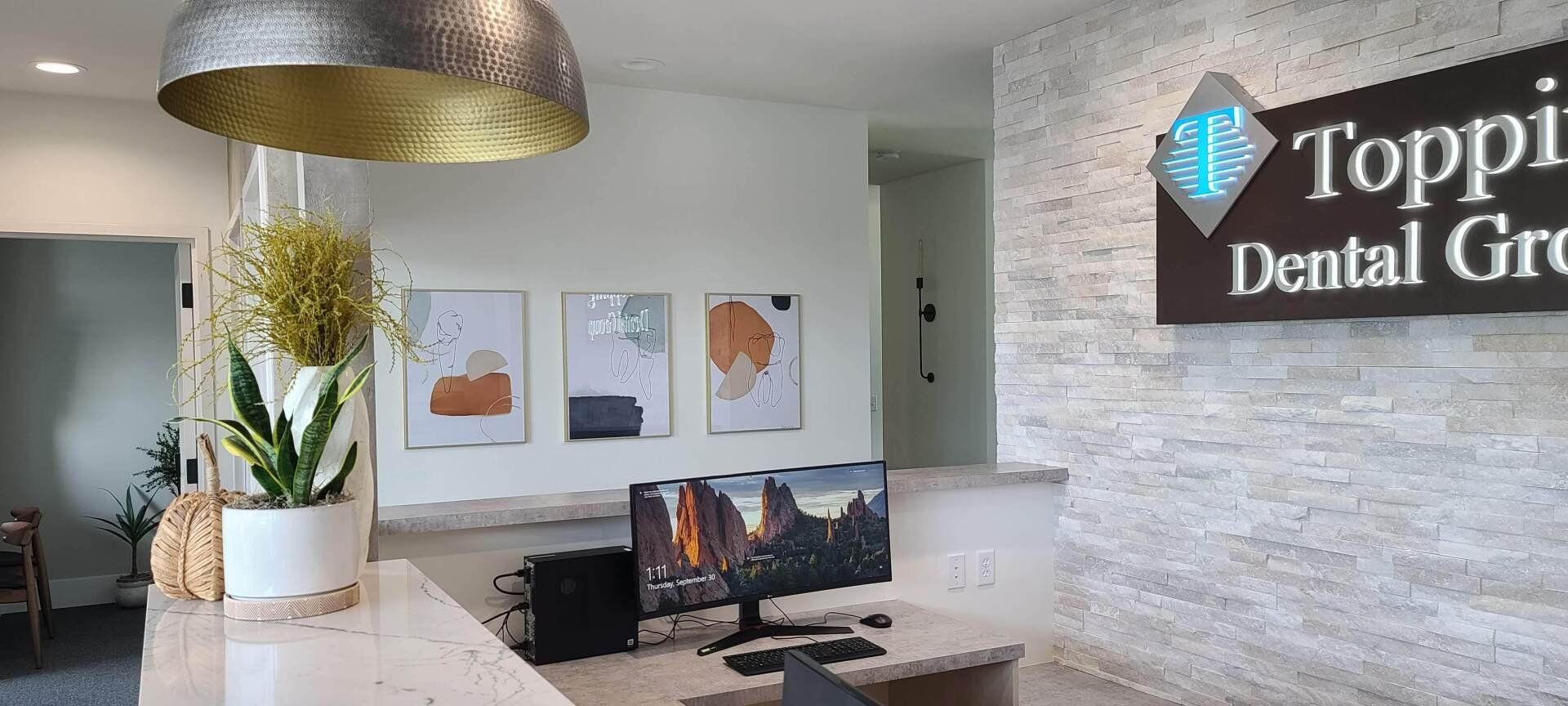 A dental office with a sign that says toppi dental group.