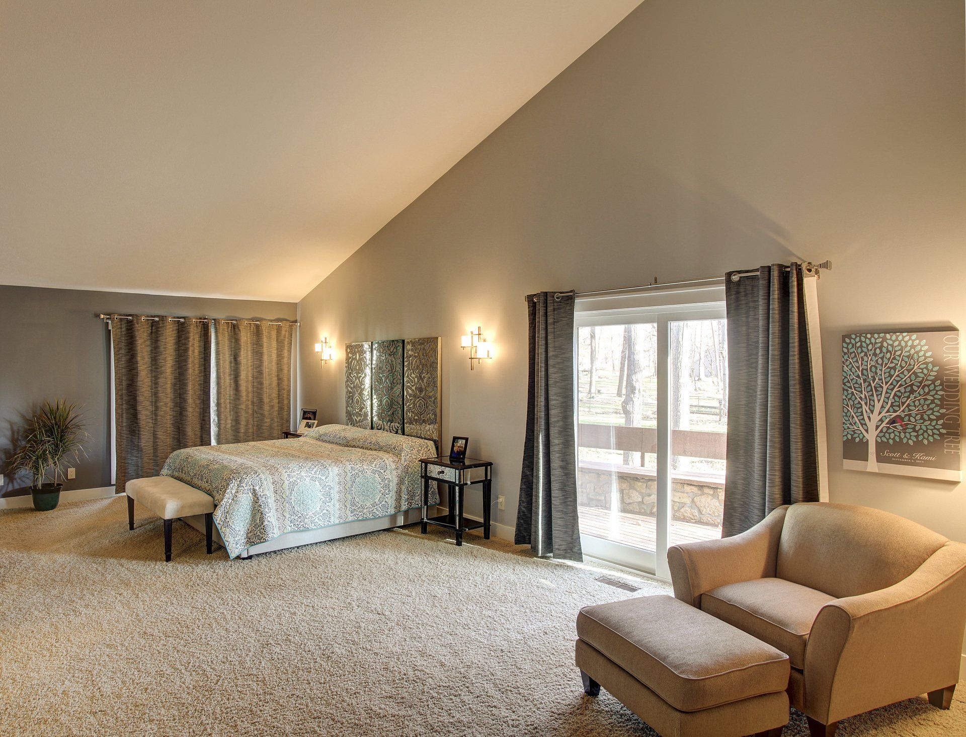 A bedroom with two beds and a sliding glass door