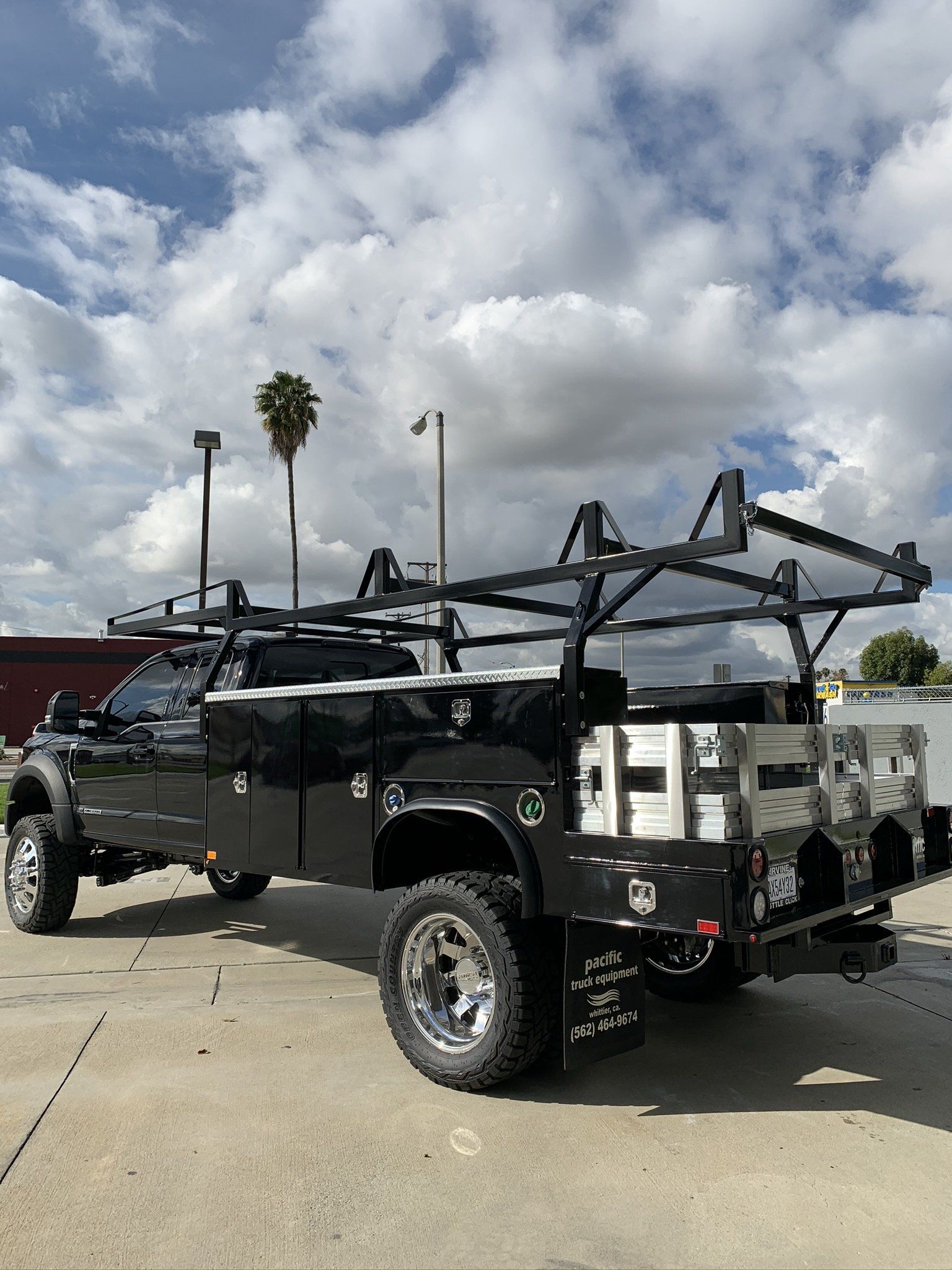 Underneath View of Lifted Black Truck — Whittier, CA — Pacific Truck Equipment Underneath View of Lifted Black Truck — Whittier, CA — Pacific Truck Equipment