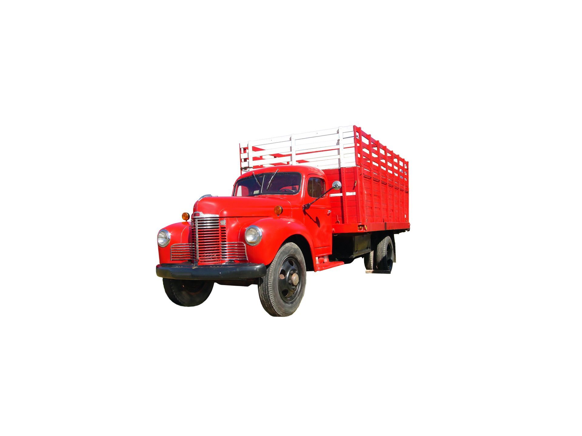 Classic red work truck equipped with stake bodies for transporting cargo and heavy loads. Classic red work truck equipped with stake bodies for transporting cargo and heavy loads.