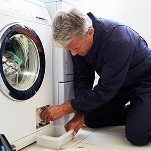 Man Repairing Dryer- Dryer Repair in Davison, MI