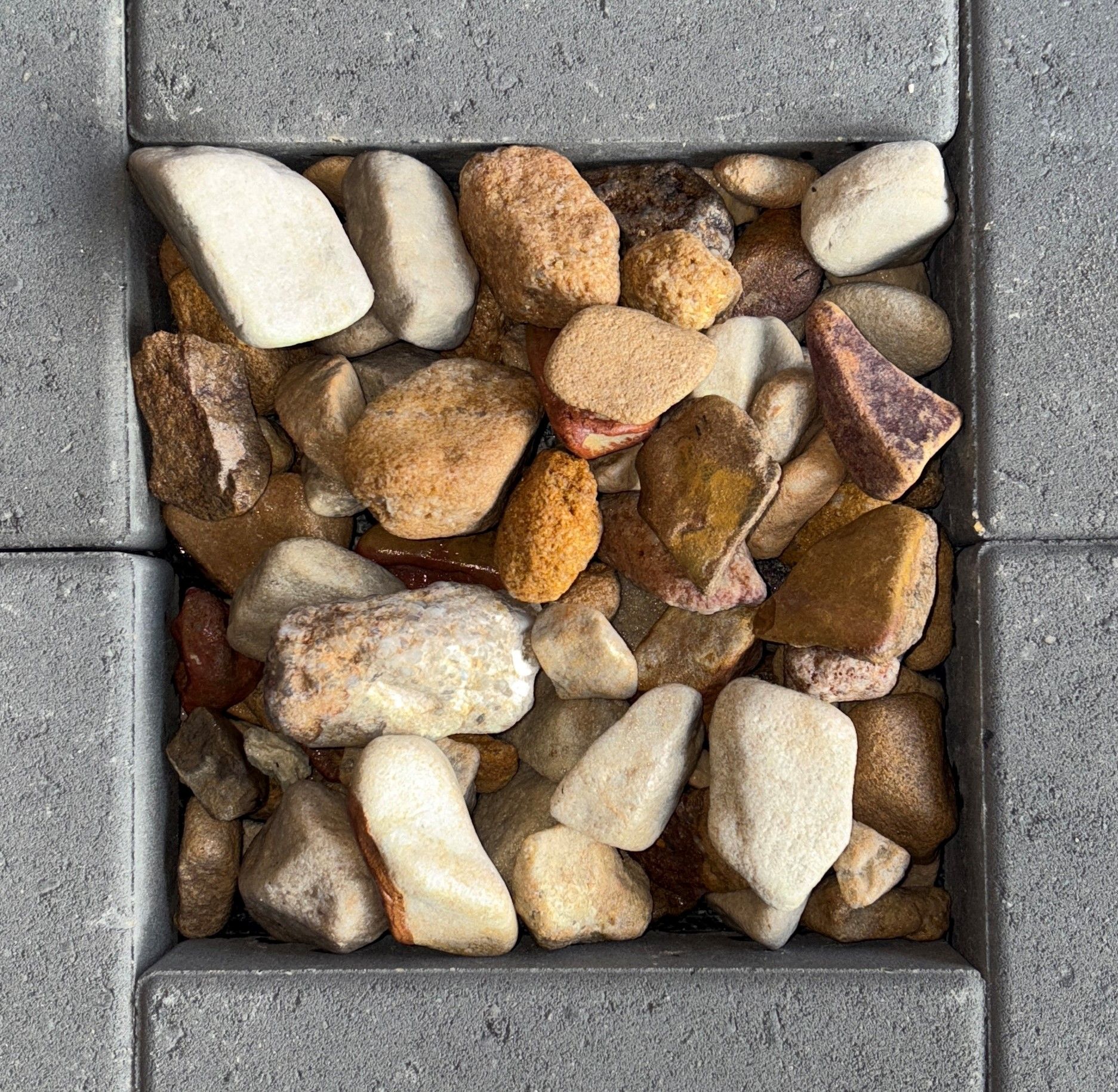 A pile of rocks on a concrete surface