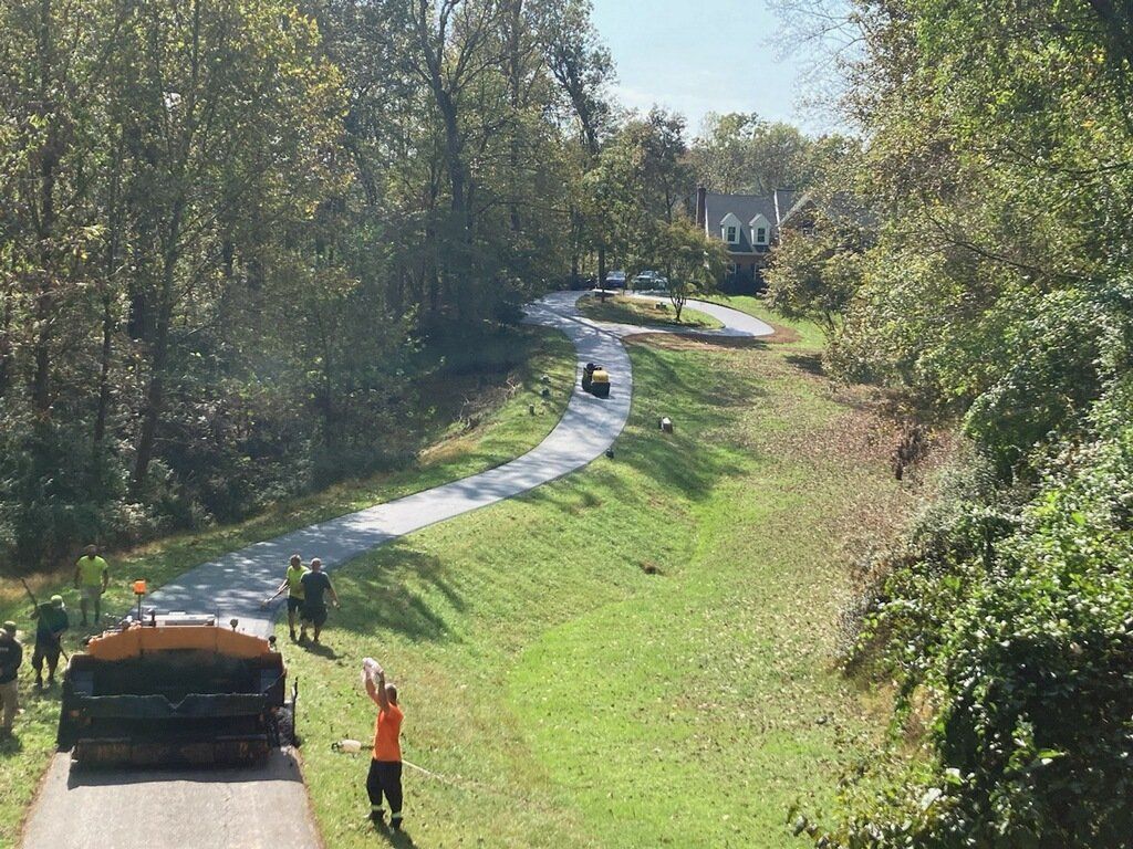 A group of people are working on a road