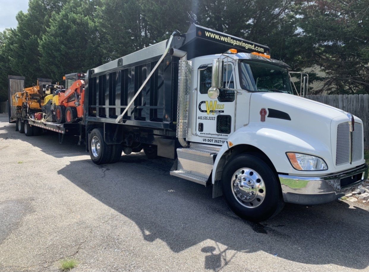 A white truck with the number 18 on it