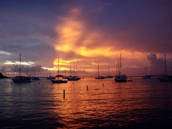 Sunset view with boats in the middle of the ocean