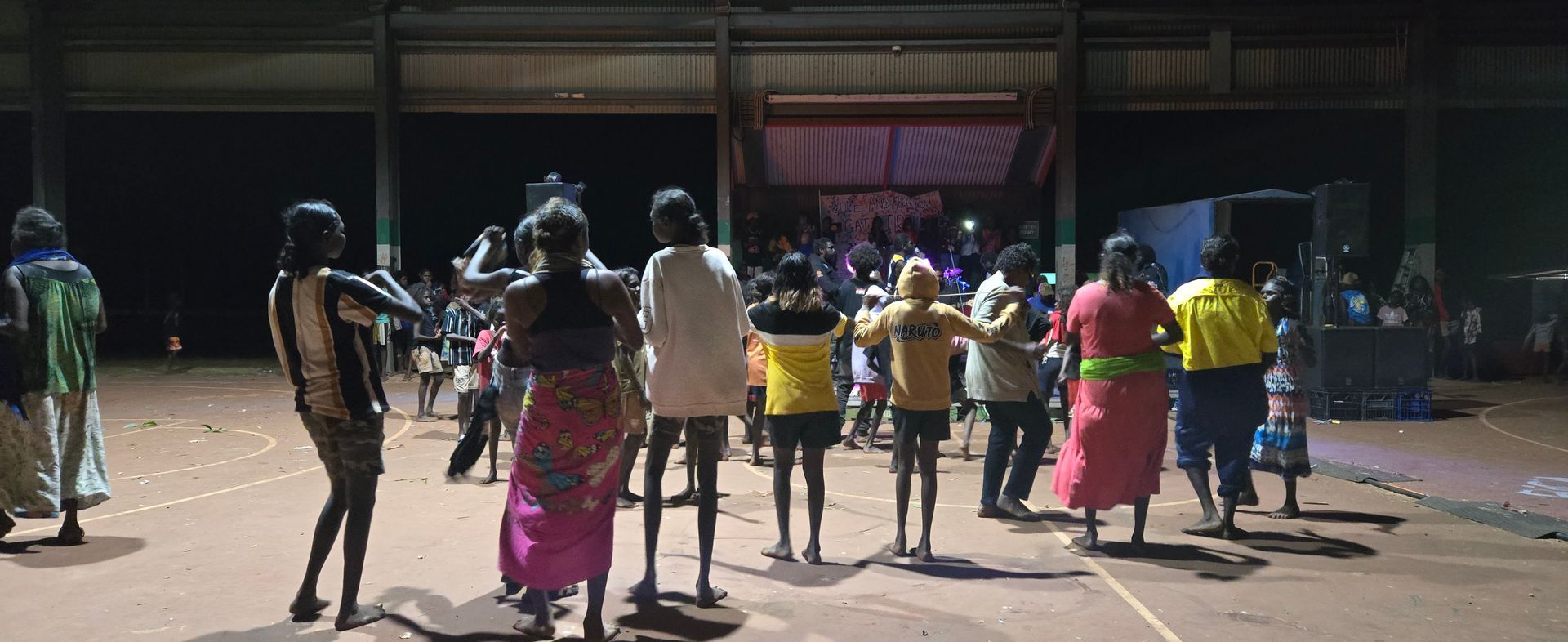 A group of people dancing and listening to music