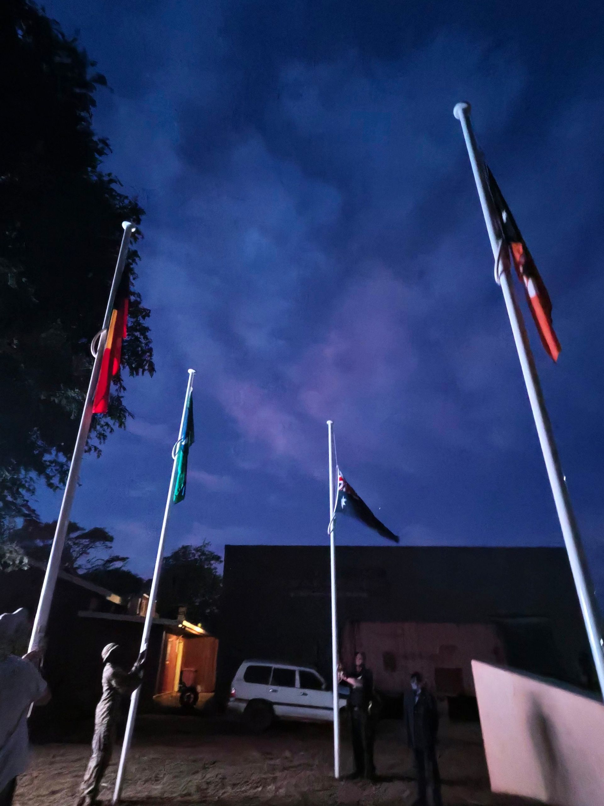 Four flag poles at Dawn