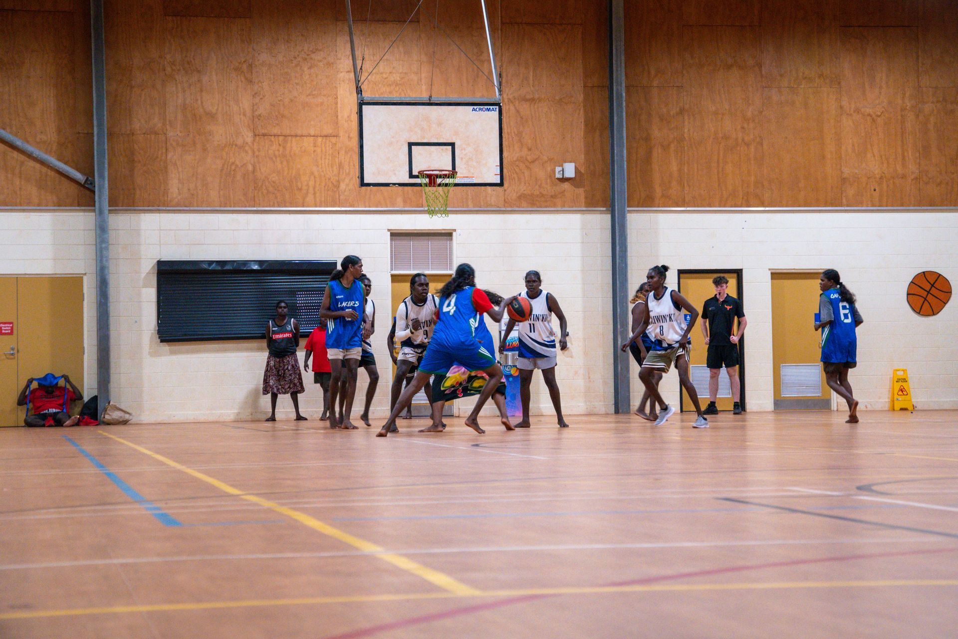 Basketball players on an indoor court
