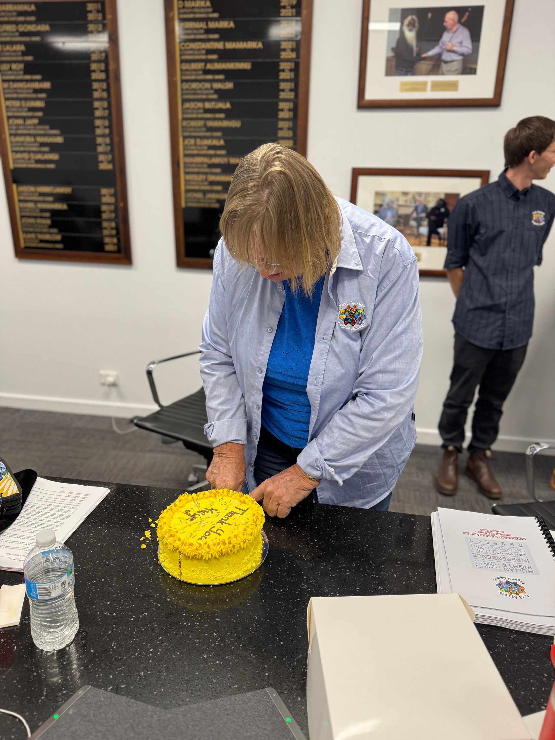 A woman with a thank you cake