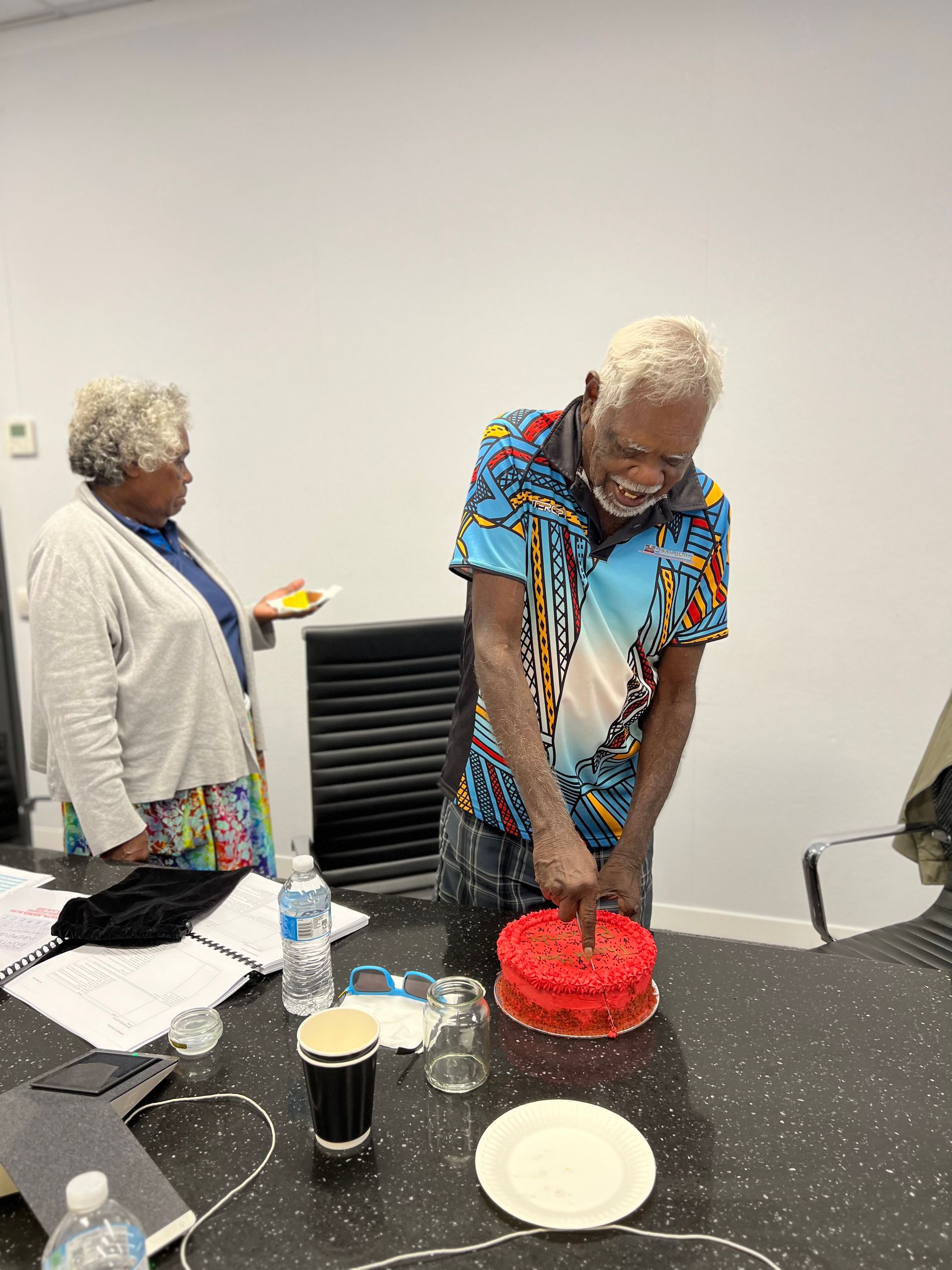 A man with a thank you cake