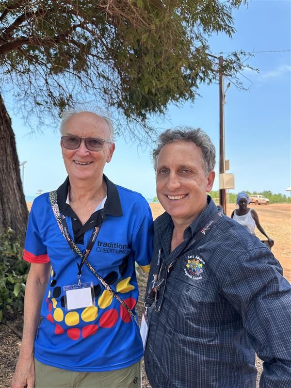 Two men standing together