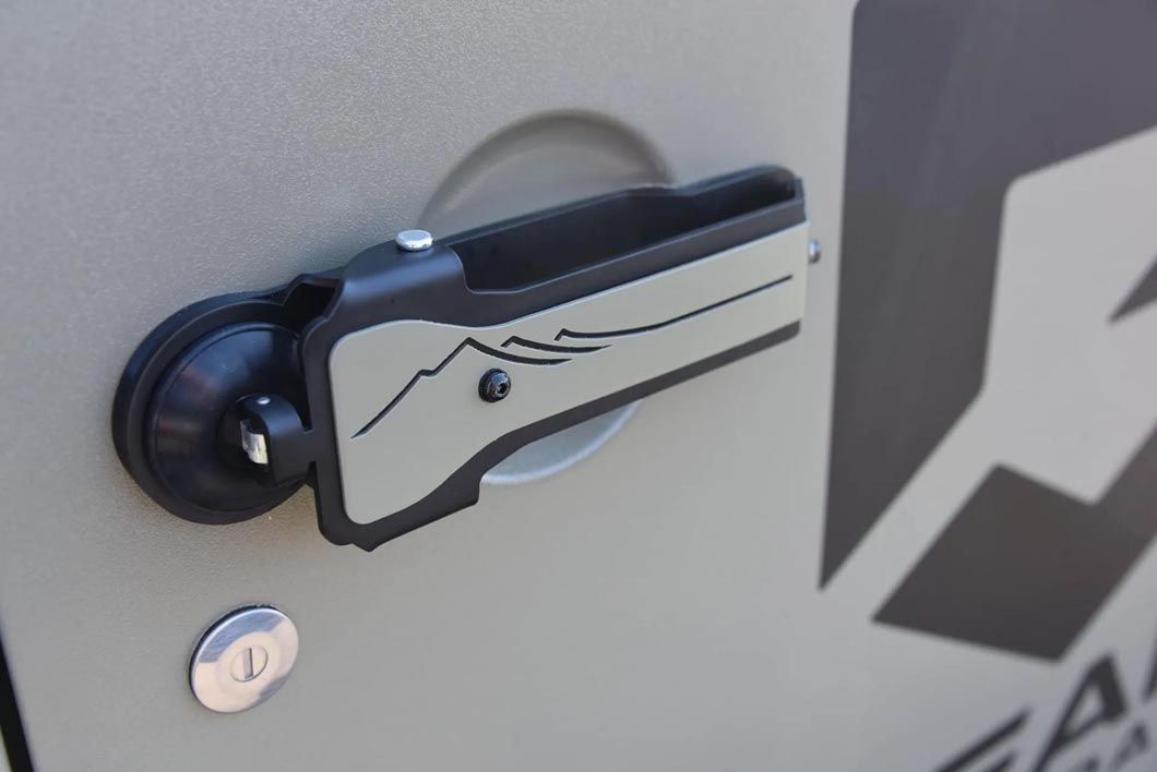 A close up of a door handle on a vehicle.