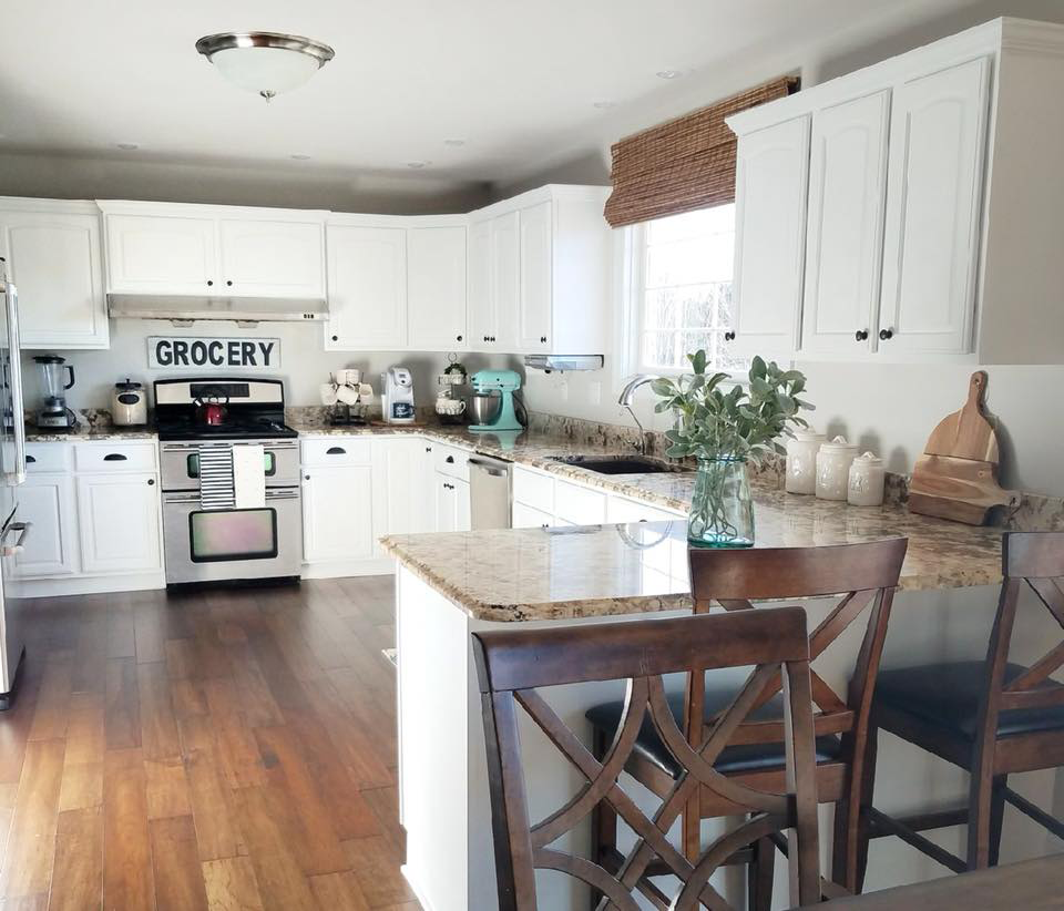 a kitchen with a sign above the stove that says grocery