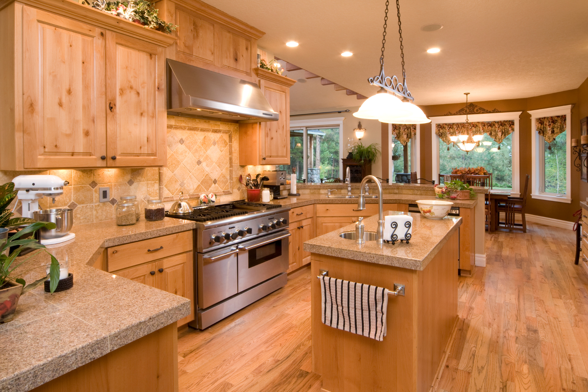 a kitchen with stainless steel appliances and wooden cabinets