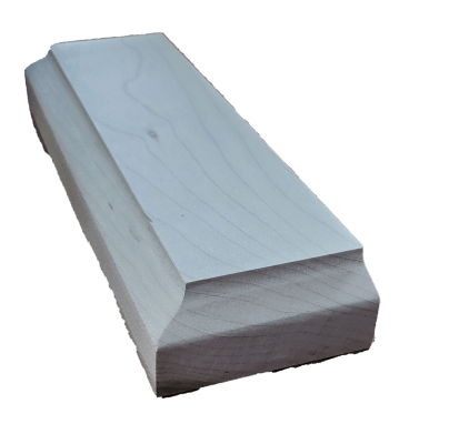 a white piece of wood is sitting on a white surface
