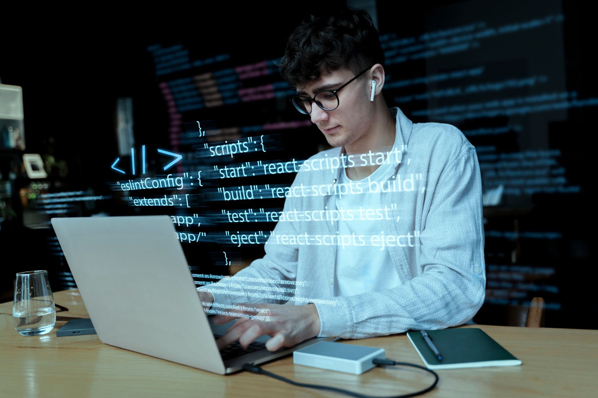 A person is typing on a laptop with the words product and software development below them