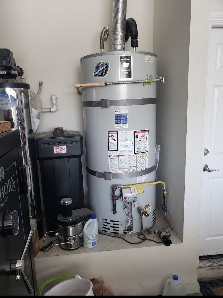 A large water heater is sitting in a corner of a room.