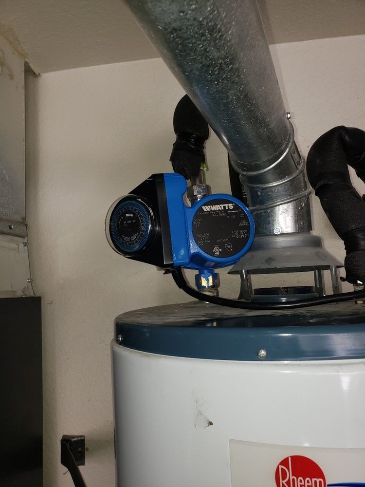 A rheem water heater is sitting in a room