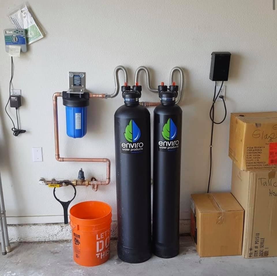 Two black bottles with the word enviro on them