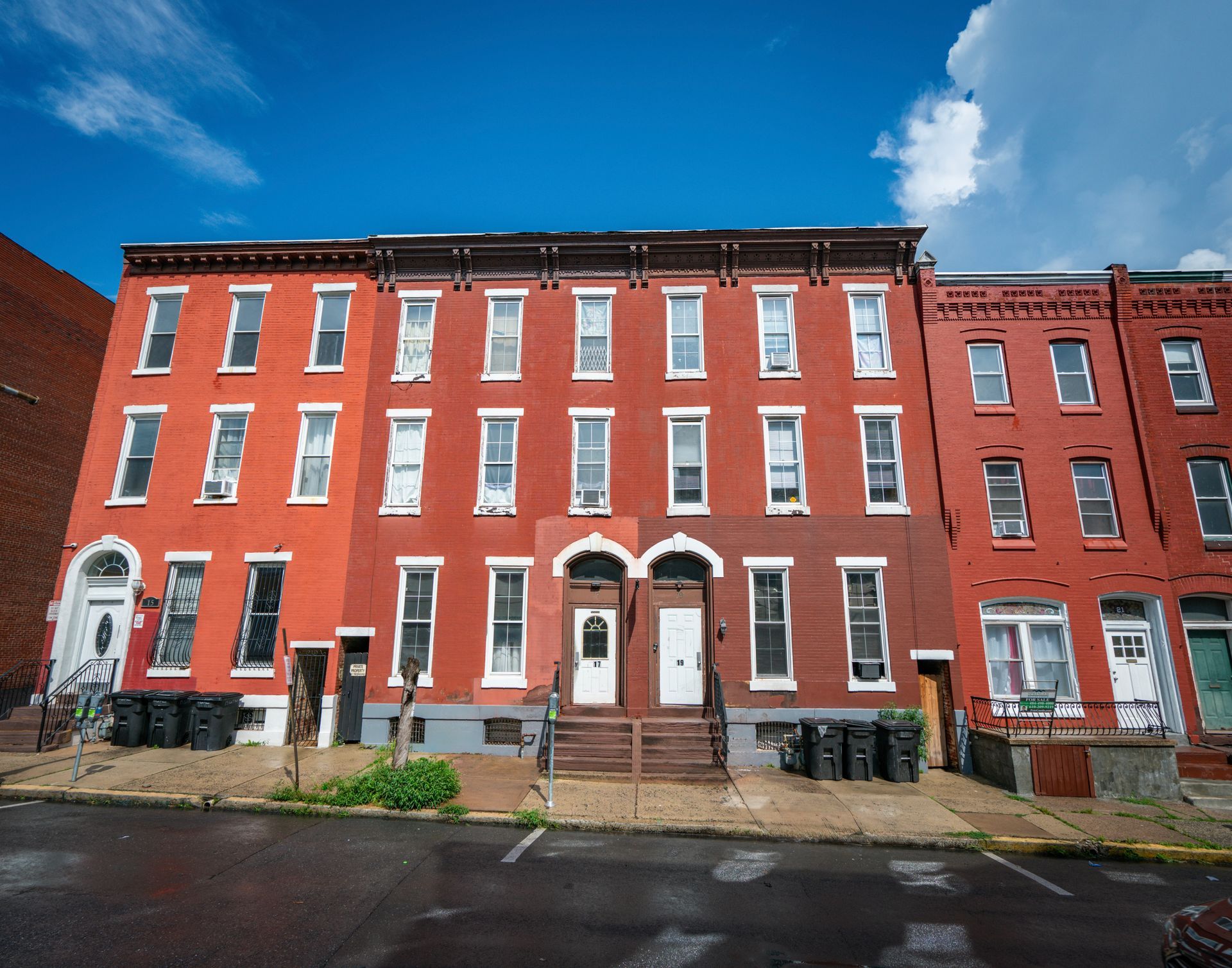 Photo of a large red brick building featuring many windows