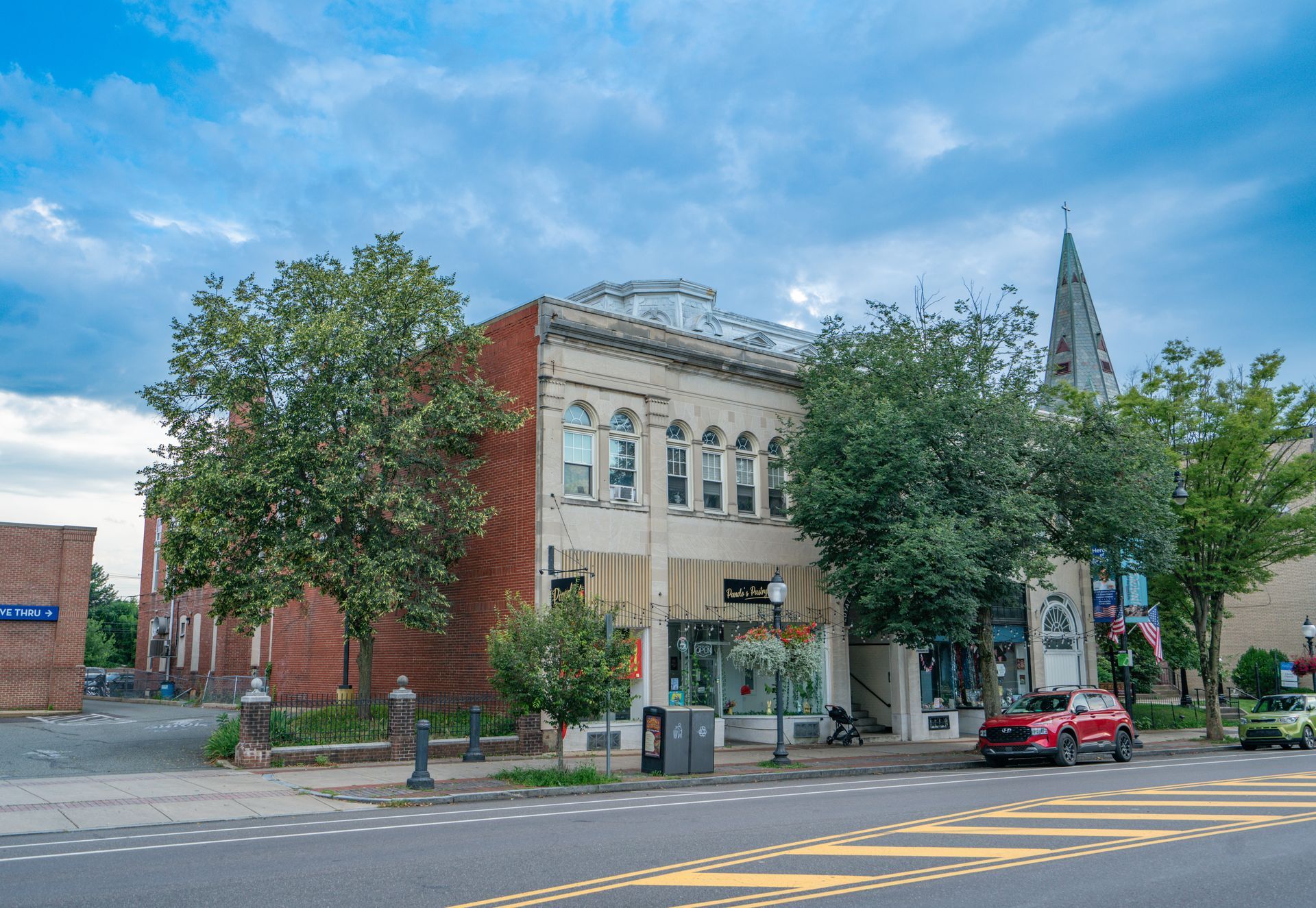 Photo of a large, two-story building, seen from across the street